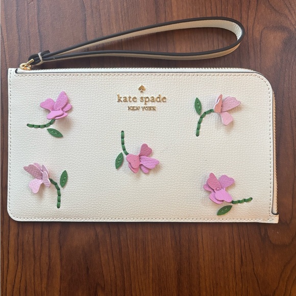 kate spade Handbags - Kate Spade Cream Wrislet with 3D Pink  Floral Design